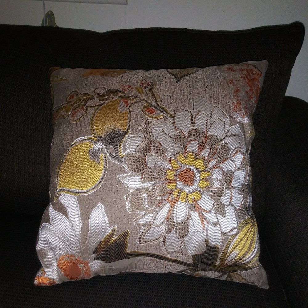 One pretty throw pillow. Great for movie night.